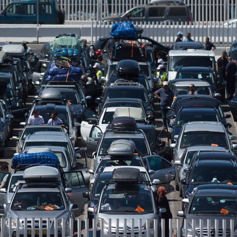Cars queue before embarking on ferries bound for Tangier at the Algeciras port on July 27, 2019. - Thousands of Moroccan nationals working and living in Europe pass through the Strait of Gibraltar as they return to spend summer holidays in Morocco. (Photo by JORGE GUERRERO / AFP) (Photo credit should read JORGE GUERRERO/AFP via Getty Images)