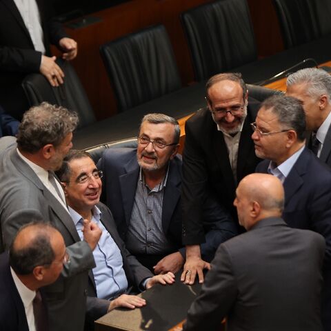Lebanese lawmakers speak prior to the start of the 12th parliamentary session to elect a new president