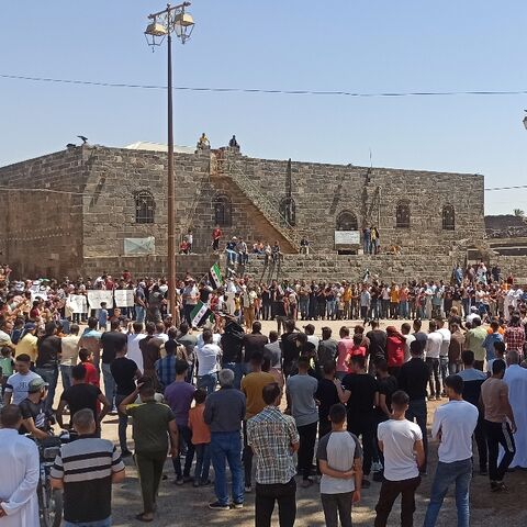 Syrians hold a rare protest against President Bashar al-Assad's government in the southern town of Bosra al-Sham