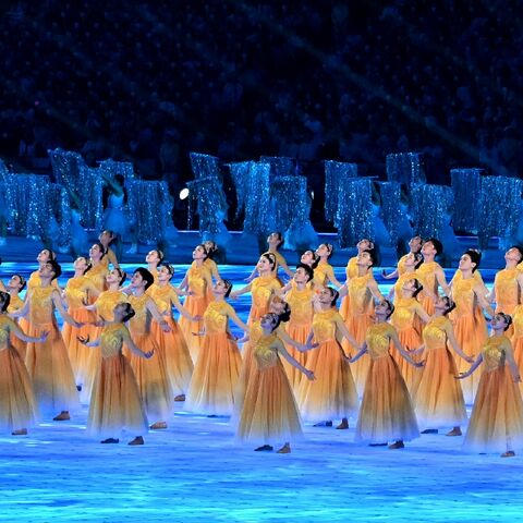 Performers take part in the opening ceremony of the Asian Games