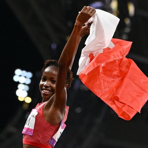 Bahrain world champion Winfred Yavi celebrates winning the Asian Games 3,000m steeplechase