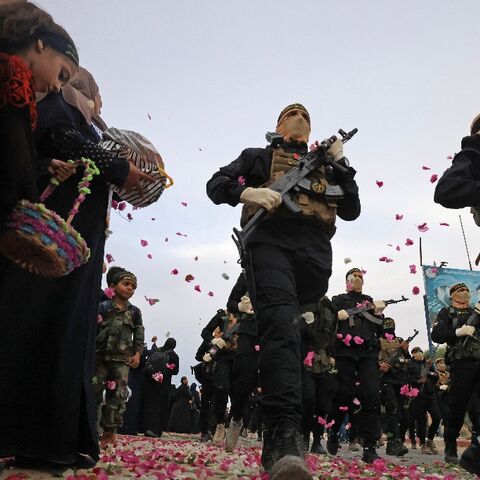 Palestinian militants of the Islamic Jihad movement participate in a military parade in Gaza City
