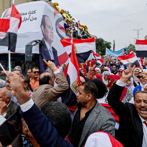 Sisi supporters hold a campaign rally outside the campus of Cairo University in Giza