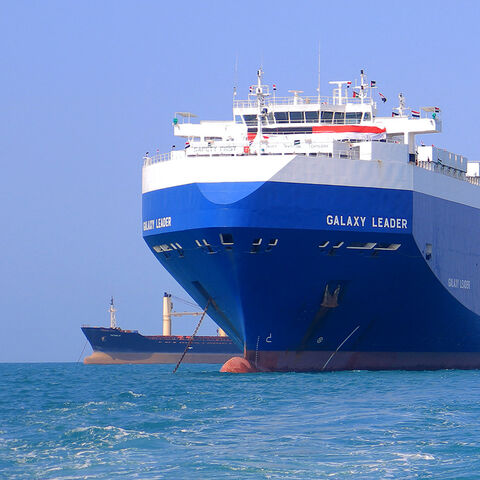 A picture taken during an organised tour by Yemen's Huthi rebels on November 22, 2023 shows the Galaxy Leader cargo ship (R), seized by Huthi fighters two days earlier, approaching the port in the Red Sea off Yemen's province of Hodeida. The Bahamas-flagged, British-owned Galaxy Leader, operated by a Japanese firm but having links to an Israeli businessman, was headed from Turkey to India when it was seized and re-routed to Hodeida November 19, according to maritime security company Ambrey. The Huthis said 