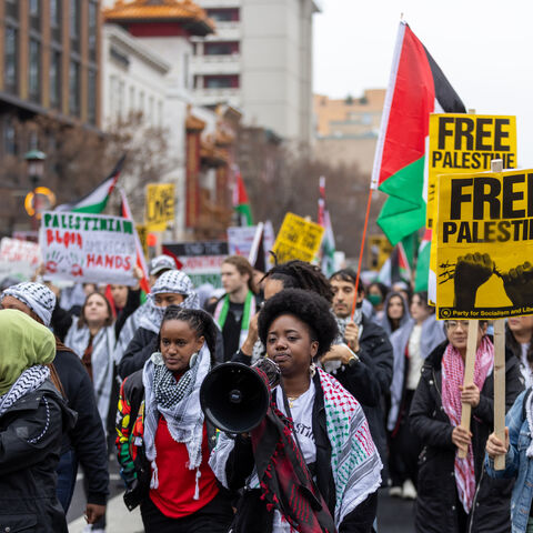 WASHINGTON, DC - DECEMBER 17: Pro-Palestinian supporters march and take over the street near Capitol One Arena, in the Chinatown area of the city on December 17, 2023 in Washington, DC. Protesters are calling for an immediate ceasefire and condemning the Israeli attacks in Gaza. (Photo by Tasos Katopodis/Getty Images)