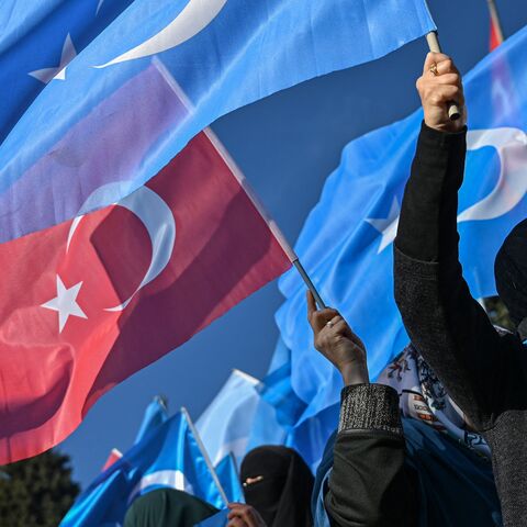 Supporters of China's Muslim Uighur minority wave flags of East Turkestan and Turkey during a demonstration at Beyazid Square, Istanbul, Dec. 14, 2019.