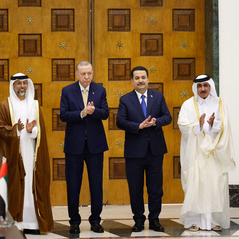(L to R) Turkey's Transport Minister Abdulkadir Uraloglu, UAE's Energy Minister Suhail Mohamed al-Mazrouei, Turkey's President Recep Tayyip Erdogan, Iraq's Prime Minister Mohammed Shia al-Sudani, Qatar's Minister of Transport Jassim bin Saif bin Ahmed al-Sulaiti, and Iraq's Transport Minister Razzaq Muhaibas al-Saadawi applaud during their meeting for the signing of the "Development Road" framework agreement on security, economy, and development in Baghdad on April 22, 2024. (Photo by Thaier Al-Sudani / POO