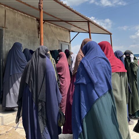 Islamic state women outside a Hawala money transfer shop at Roj camp in northeastern Syria, April 9, 2024. 