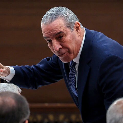 Secretary General of the Executive Committee of the Palestine Liberation Organization (PLO), Hussein al-Sheikh, gestures as he arrives for the 32nd Palestinian Liberation Organization (PLO) Central Council session in Ramallah on April 23, 2025. Palestinian president Mahmud Abbas on April 23 urged Hamas to free all hostages in Gaza, saying their captivity provided Israel with "excuses" to attack the territory, as rescuers recovered charred bodies from an Israeli strike. (Photo by Zain JAAFAR / AFP) (Photo by