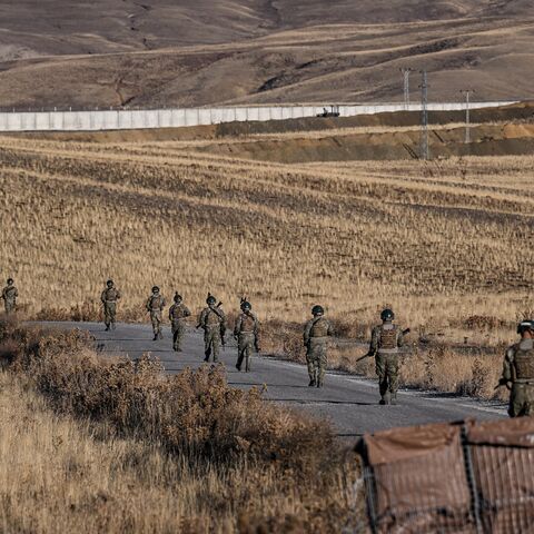 Turkish soldiers patrol near the border wall between Turkey and Iran in the Van Province, eastern Turkey, on Nov. 1, 2024. 