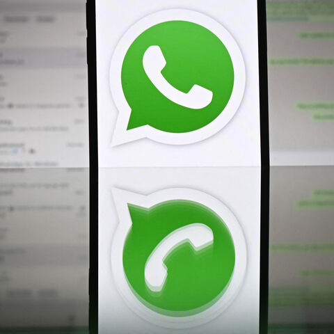 An illustration photograph taken on April 17, 2025 shows Whatsapp web displayed on a laptop screen with a phone displaying the Whatsapp logo, in a residential property in Guildford, south of London. (Photo by Justin TALLIS / AFP) (Photo by JUSTIN TALLIS/AFP via Getty Images)
