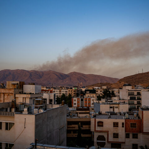 Smoke rises as fire burns, in an alleged site of IRGC's missile launch targeted by Israel on the mountains of Shiraz, Iran, June 21, 2025.