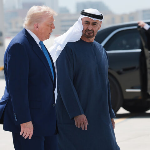 ABU DHABI, UNITED ARAB EMIRATES - MAY 16: U.S. President Donald J. Trump talks to UAE President Sheikh Mohamed bin Zayed Al Nahyan as he departs the Al Bateen Executive Airport on May 15, 2025, in Abu Dhabi, United Arab Emirates. Trump is on the fourth and final day of his visit to the Gulf to underscore the strategic partnership between the United States and regional allies including the UAE, focusing on security and economic collaboration. (Photo by Win McNamee/Getty Images)
