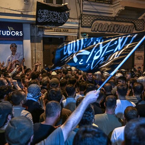 Islamist protesters clash with Turkish anti-riot police officers as they gather to protests LeMan cartoon magazine in Istanbul on June 30, 2025.