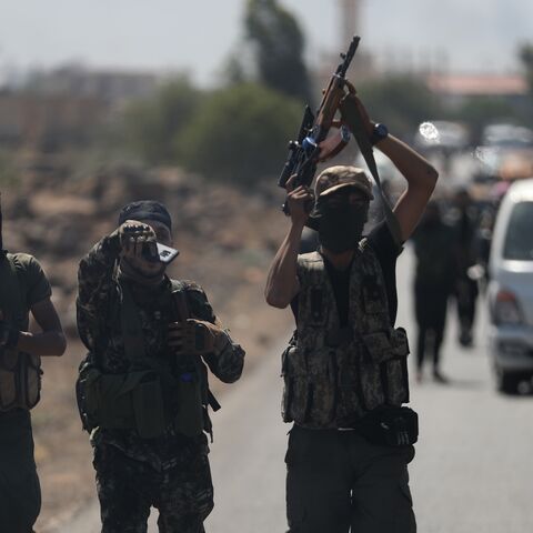 Bedouin fighters are seen on the streets of al-Mazraa village in Syria's southern Suwayda governorate on July 18, 2025, in Suwayda, Syria. 