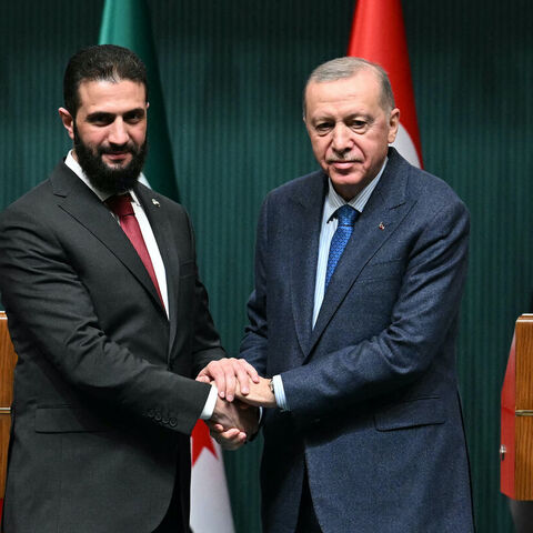 Turkish President Recep Tayyip Erdogan (R) and Syria's interim President Ahmed al-Sharaa shake hands during a joint press conference following their meeting at the Presidential Palace in Ankara, on Feb. 4, 2025. — OZAN KOSE/Getty