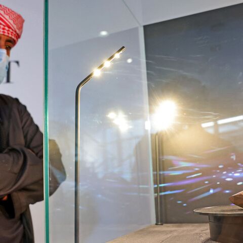 A picture taken on Jan. 17, 2022, shows "The Enigma," a 555.55-carat black diamond, at Sotheby's in the Gulf emirate of Dubai. 