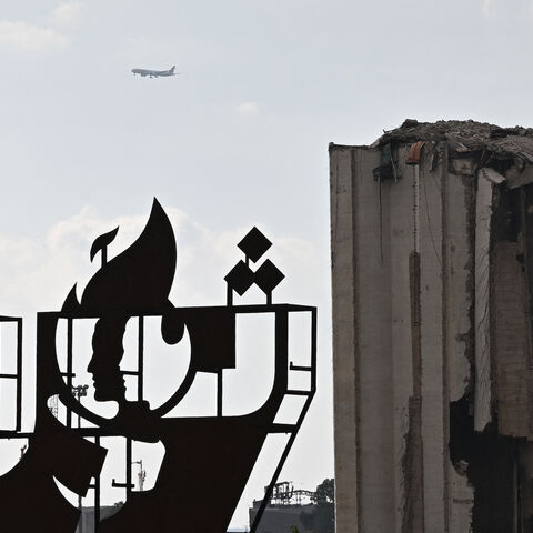 A picture shows a metal installation set up across from the destroyed Beirut port silos during a gathering to honour the victims of the catastrophic port explosion in 2020 and to call for accountability for the blast, in Beirut on August 4, 2025. Lebanese President Joseph Aoun on August 4, vowed justice and accountability five years after a catastrophic explosion at Beirut's port, as the investigating judge finished questioning defendants, a judicial official said. (Photo by JOSEPH EID / AFP) (Photo by JOSE