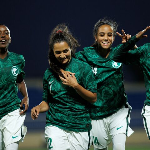 Saudi Arabia's Bayan Sadagah (C-L) celebrates her goal during a friendly football match between Saudi Arabia and Bhutan at Prince Sultan bin Abdulaziz stadium in Abha on September 24, 2022. (Photo by AFP) (Photo by -/AFP via Getty Images)
