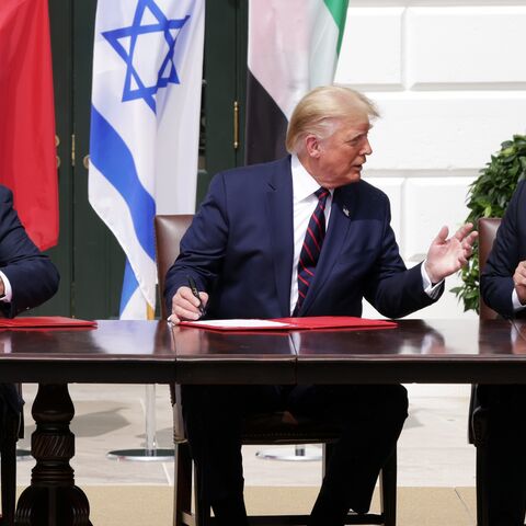 Prime Minister of Israel Benjamin Netanyahu, US President Donald Trump, and Foreign Affairs Minister of the United Arab Emirates Abdullah bin Zayed bin Sultan Al Nahyan.