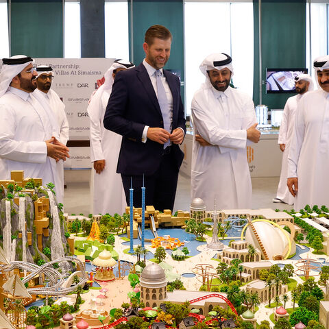Eric Trump, executive vice president of the Trump Organization and the US president's son, looks over the proposed plan ahead of the signing ceremony with Qatar's Diar and Dar Global, Doha, Qatar, April 30, 2025.