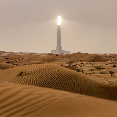 The tallest solar power tower in the world at 260 meters is pictured at the concentrated solar thermal power Noor Energy 1 solar complex at Mohammed bin Rashid Al Maktoum Solar Park, about 50 kilometers south of Dubai, on July 19, 2025.