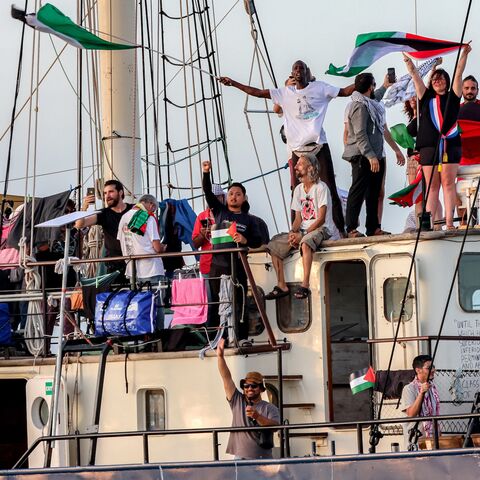 Activists and human rights defenders ride aboard a vessel departing from Tunisia's northern port of Bizerte on Sept. 14, 2025.