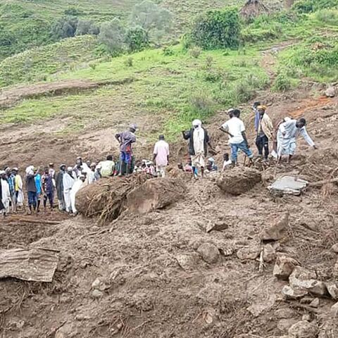 People inspect the debris following a landslide that devastated the village of Tarasin, in Sudan's Jebel Marra area, on Sept. 2, 2025.