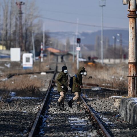 Several trucks carrying humanitarian aid cross the border between Armenia and Turkey at the village of Margara, Armenia, on March 21, 2025. 
