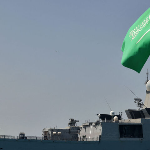 A Saudi navy ship is pictured docked at King Faisal navy base in Jeddah before the departure of a team to Port Sudan to help with the evacuation efforts of people fleeing Sudan, on April 29, 2023. - Warplanes on bombing raids drew heavy anti-aircraft fire over Khartoum as fierce fighting between Sudan's army and paramilitaries entered a third week, despite a renewed truce. (Photo by Fayez NURELDINE / AFP) (Photo by FAYEZ NURELDINE/AFP via Getty Images)