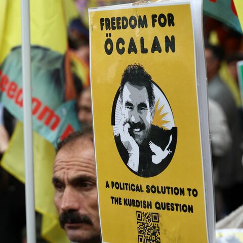 Kurds wave Kurdistan Workers' Party flags (PKK) and flags depicting Kurdistan Worker's Party (PKK) leader Abdullah Ocalan, during a demonstration to call for Ocalan's liberation outside the European Council in Strasbourg, eastern France, on Sept. 15, 2025. 