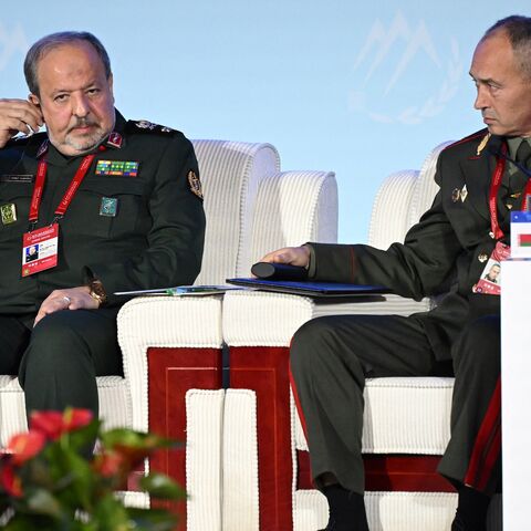 Iran's Deputy Defense Minister Majid Ebnoreza (L) sits next to Andrei Matsiyevich.