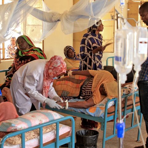 A nurse treats a Dengue fever patient at a hospital in Omdurman, west of the Sudanese capital, Khartoum, on Sept. 24, 2025. 