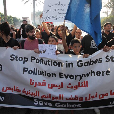 Residents of the city of Gabes carry placards during a demonstration on Oct. 15, 2025, to demand the closure of chemical factories.