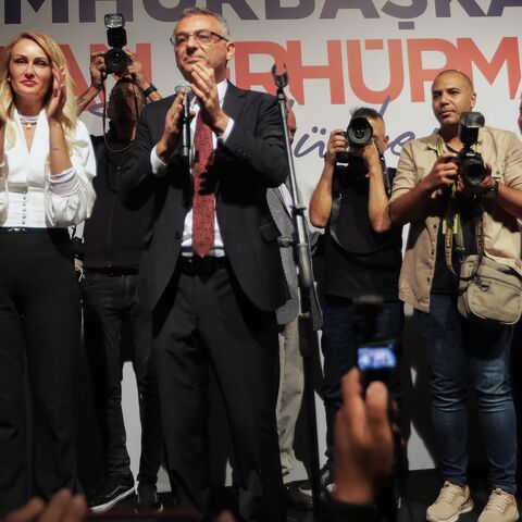 Tufan Erhurman and his wife, Nilden Erhurman, celebrate on stage after their victory in the Turkish Cypriot leadership election in the self-proclaimed Turkish Republic of Northern Cyprus on Oct. 19, 2025.