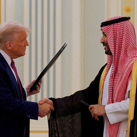 U.S. President Donald Trump and Saudi Crown Prince and Prime Minister Mohammed Bin Salman shake hands during a Memorandum of Understanding (MOU) signing ceremony at the Royal Court in Riyadh, Saudi Arabia, May 13, 2025. REUTERS/Brian Snyder