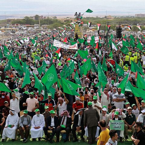 Supporters of Jordan's Muslim Brotherhood take part in a protest in the village of Sweimeh, near the Jordanian border with the occupied West Bank, on May 21, 2021.