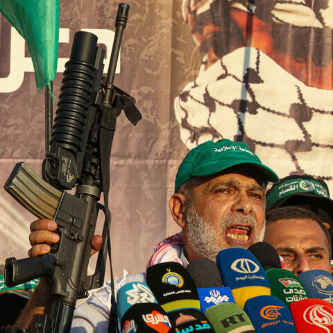 Bassam Hammoud the vice president of the Jamaa Islamiya in Lebanon, brandishes a rifle as he delivers a speech during a demonstration in Sidon in southern Lebanon on July 19, 2024, a day after an Israeli strike in the Bekaa region killed Mohammed Hamed Jabara, the commander of the Hamas-allied group in Lebanon. (Photo by Mahmoud ZAYYAT / AFP) (Photo by MAHMOUD ZAYYAT/AFP via Getty Images)