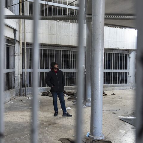 A Syrian man inspects the prison of Saydnaya, north of Damascus on Dec. 16, 2024.