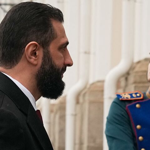 Syrian interim President Ahmed al-Sharaa arrives at the Grand Kremlin Palace for his meeting with Russia's president in Moscow on Oct. 15, 2025. 