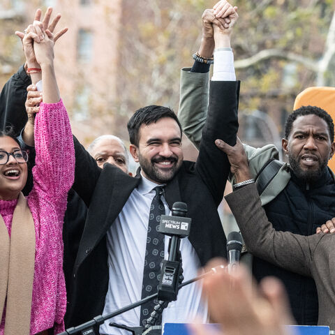 NEW YORK, NEW YORK - NOVEMBER 1: Democratic New York City mayoral candidate Zohran Mamdani (C) raises his hands during a campaign event with New York City elected officials on November 1, 2025 in the Queens borough of New York City. With only days left in the race for New York City's next mayor, Mamdani remains the front runner against Independent candidate, former New York Gov. Andrew Cuomo and Republican candidate Curtis Sliwa. (Photo by Stephanie Keith/Getty Images)