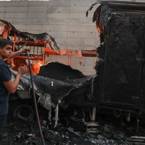 A Palestinian man tries to extinguish flames from a burning truck after an Israeli settlers attack in the village of Beit Lid, east of Tulkarm, in the occupied West Bank on Nov. 11, 2025.