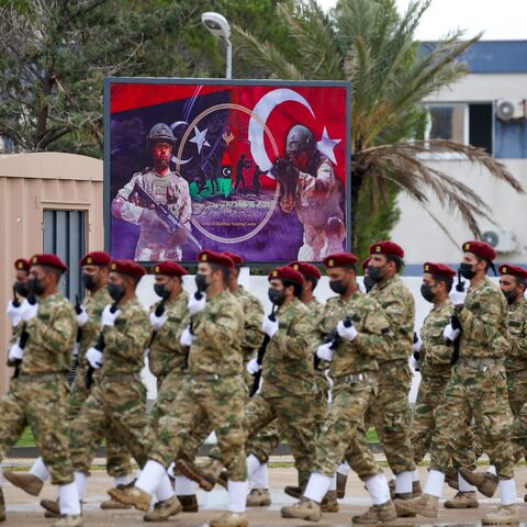 Libyan military graduates loyal to the UN-recognised Government of National Accord (GNA) take part in a parade marking their graduation, a result of a military training agreement with Turkey, at the Omar Mukhtar camp in the city of Tajoura, southeast of the capital Tripoli on November 21, 2020. (Photo by Mahmud TURKIA / AFP) (Photo by MAHMUD TURKIA/AFP via Getty Images)