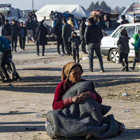 Syrian Kurds, fleeing from north of Aleppo, arrive in Tabqa, on the western outskirts of Raqa, on Dec. 4, 2024. 