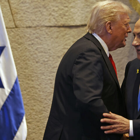 President Donald Trump speaks with Israel's Prime Minister Benjamin Netanyahu in the Knesset, Israel's parliament, on Oct. 13, 2025 in Jerusalem.