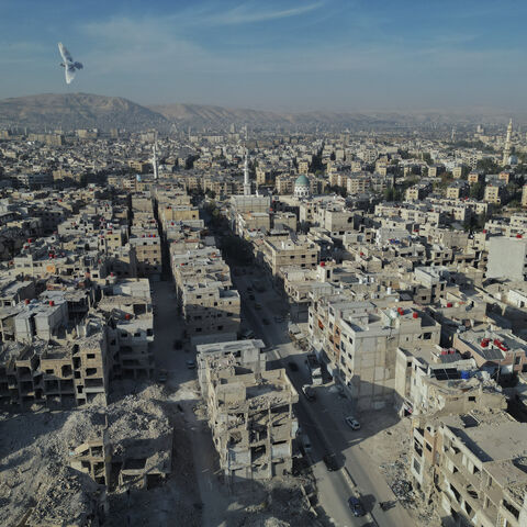 An aerial view shows the destruction across Yarmouk camp, Damascus, Syria, on November 8, 2025. Established in 1957, Yarmouk was once the largest Palestinian refugee community in Syria, but years of conflict left much of it in ruins. (Photo by Omar Albaw / Middle East Images via AFP) (Photo by OMAR ALBAW/Middle East Images/AFP via Getty Images)