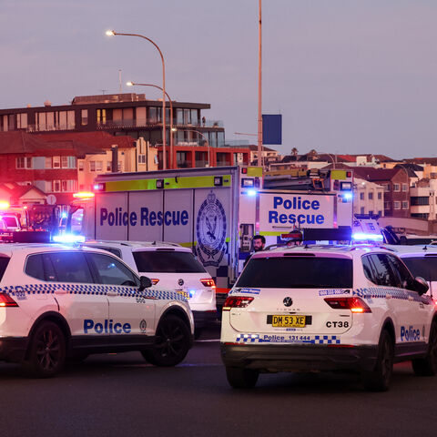 Police vehicles are seen on a road after a shooting incident at Bondi Beach in Sydney on Dec. 14, 2025. 