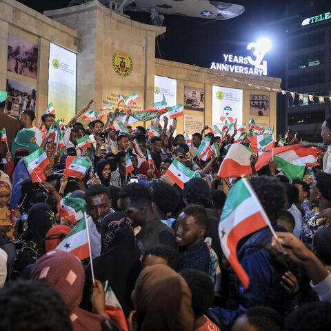 Residents wave Somaliland flags as they gather to celebrate Israel's announcement recognizing Somaliland's statehood in downtown Hargeisa, on Dec. 26, 2025. 