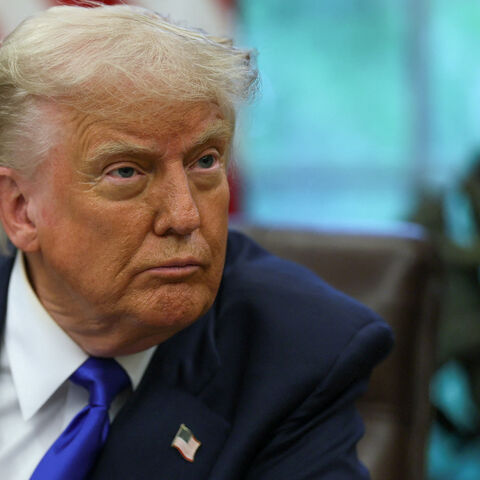 FILE PHOTO: U.S. President Donald Trump looks on as he signs executive orders and proclamations in the Oval Office at the White House, in Washington, D.C., U.S., May 5, 2025. REUTERS/Leah Millis/File Photo