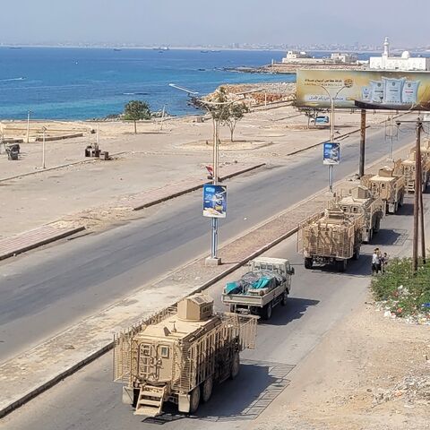 A convoy of armoured vehicles makes its way along a street in southern Yemen on January 1